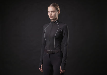 Velmurax women's long-sleeve riding top in black, in a three-quarter view on the model on the studio set