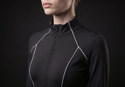 Velmurax women's long-sleeve riding top in black, in a close detail shot on the model