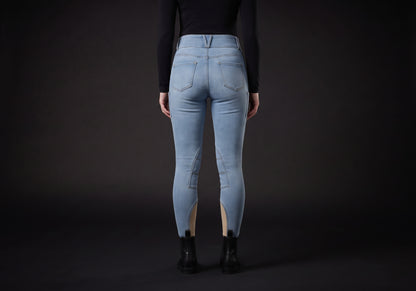 Velmurax women's high-waisted denim riding breeches in light blue, worn, seen from the back