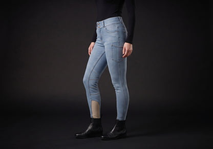 Velmurax women's high-waisted denim riding breeches in light blue, worn, in side profile