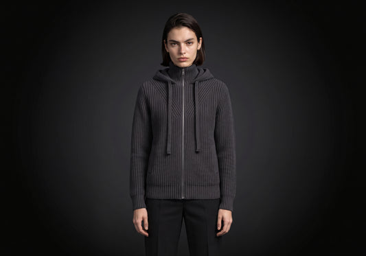 Velmurax women's hooded knit cardigan in charcoal, worn by the model in a front view on the dark studio set