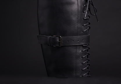 Velmurax women's lace-up knee-high boots in black, the closure up close, worn