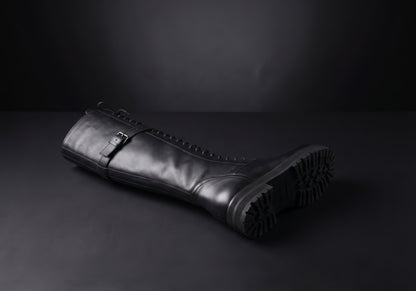 Velmurax women's lace-up knee-high boots in black, showing the outsole and heel
