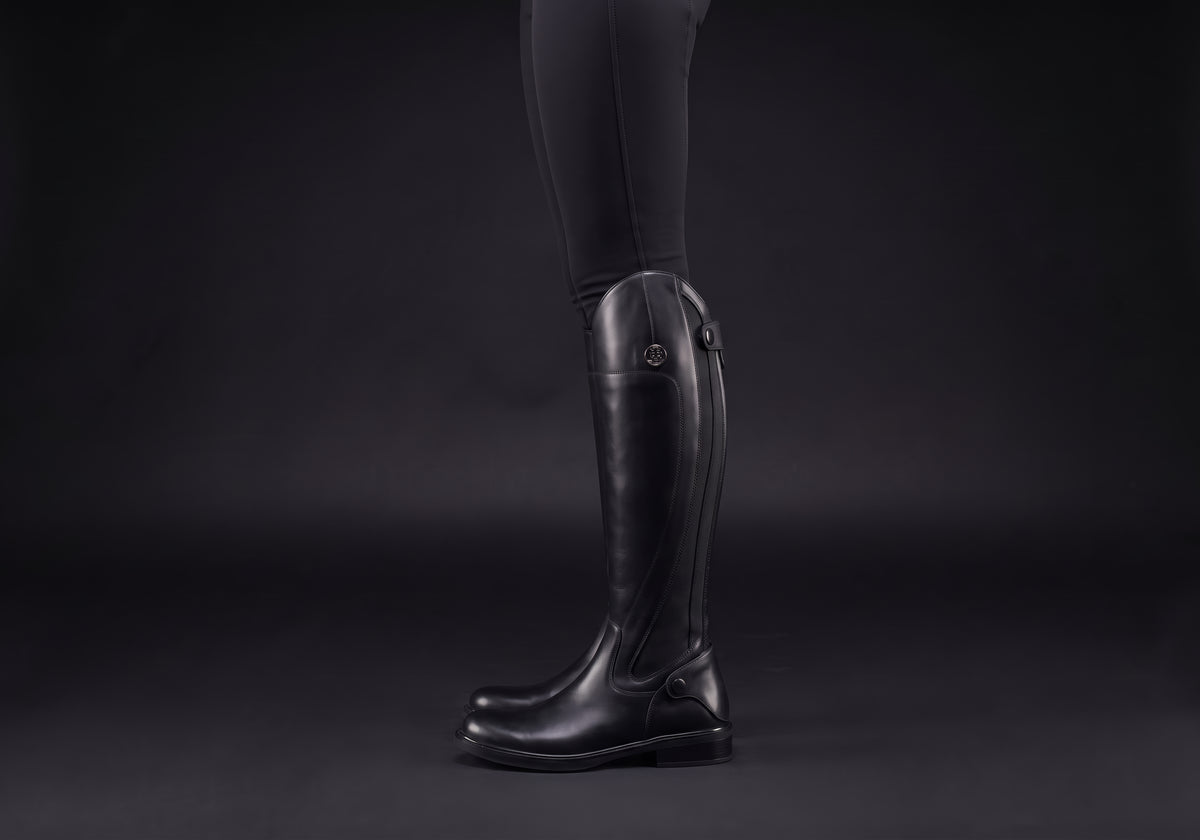 Velmurax women's long riding boots in black, worn, in side profile
