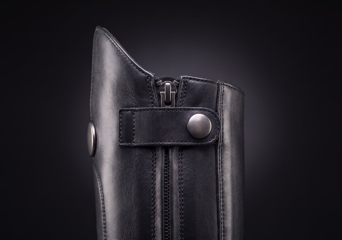 Velmurax women's long riding boots in black, the closure up close, worn