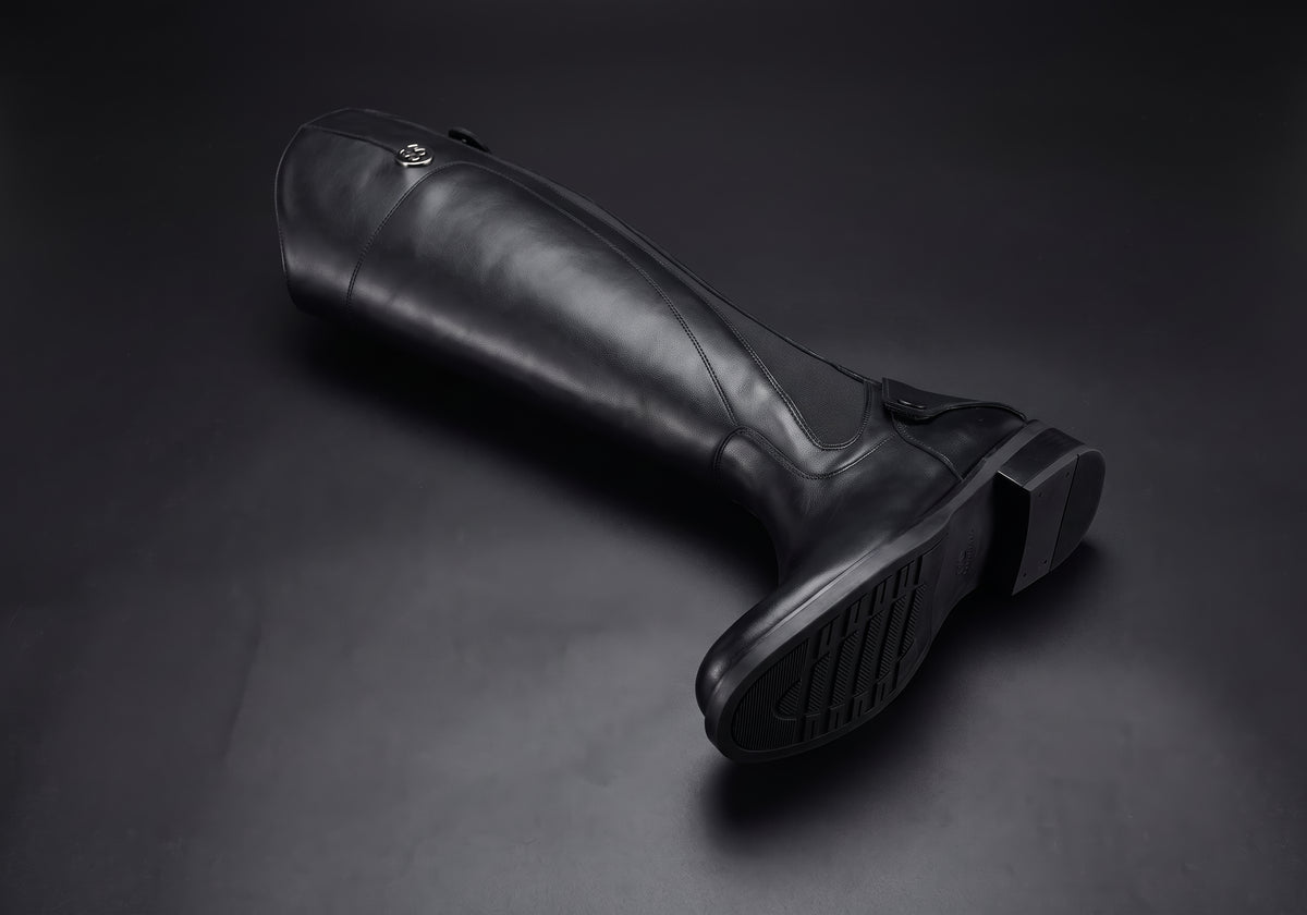 Velmurax women's long riding boots in black, showing the outsole and heel