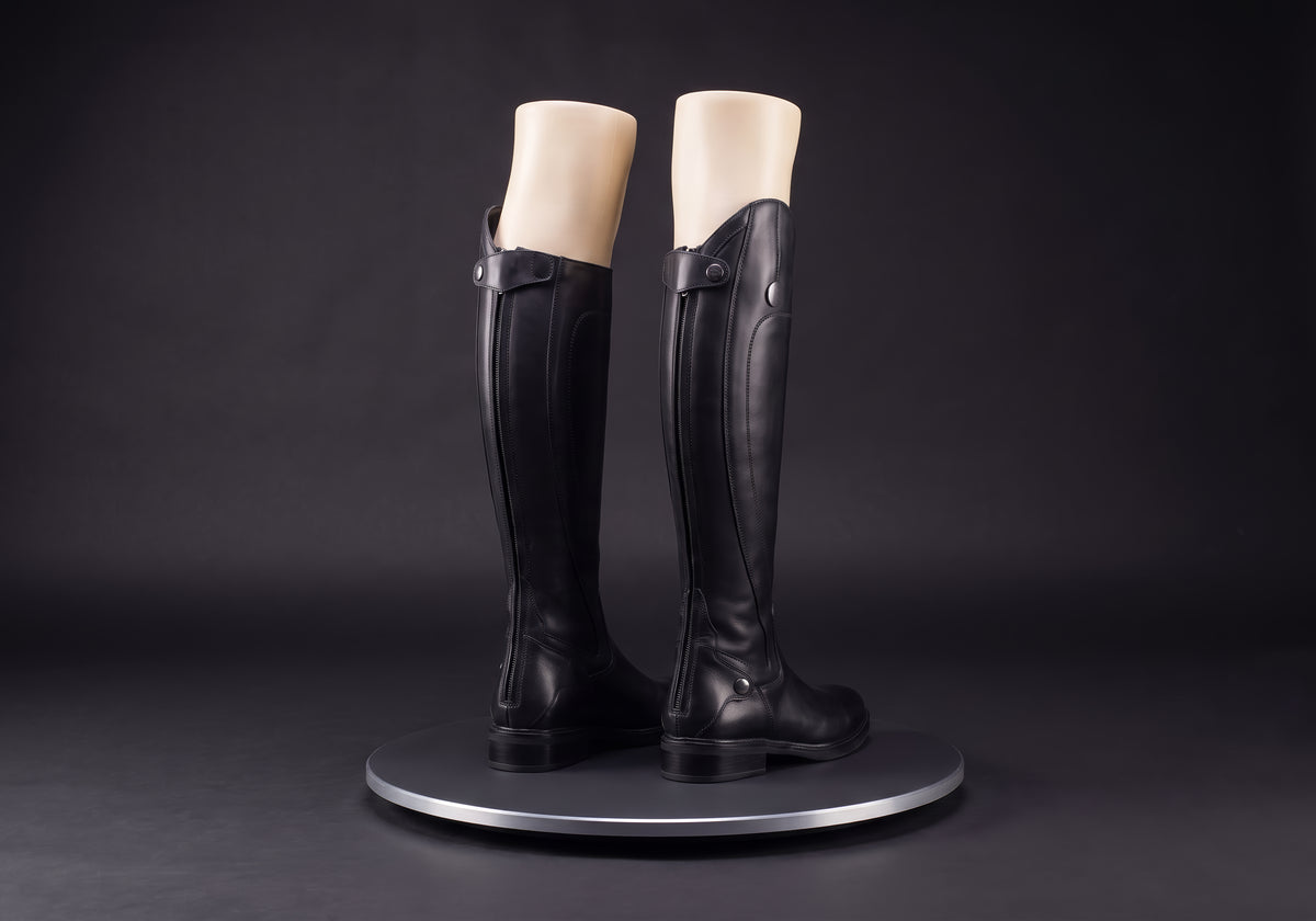 Velmurax women's long riding boots in black, on a display mannequin on the studio turntable