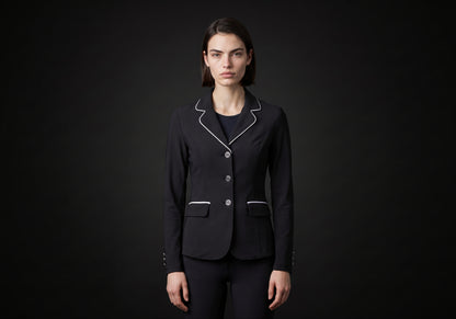 Velmurax women's show jacket in black, worn by the model in a front view on the dark studio set