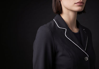 Velmurax women's show jacket in black, in a close detail shot on the model