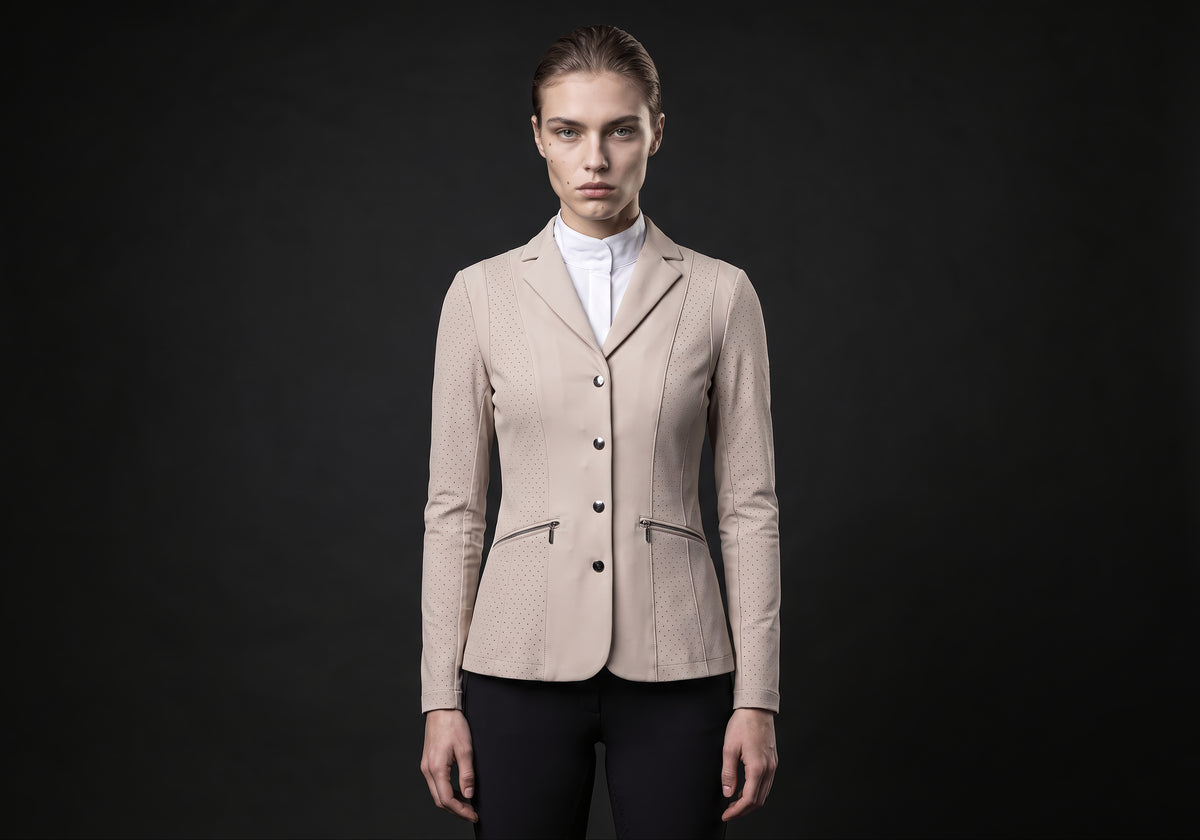 Velmurax women's show jacket in beige, worn by the model in a front view on the dark studio set