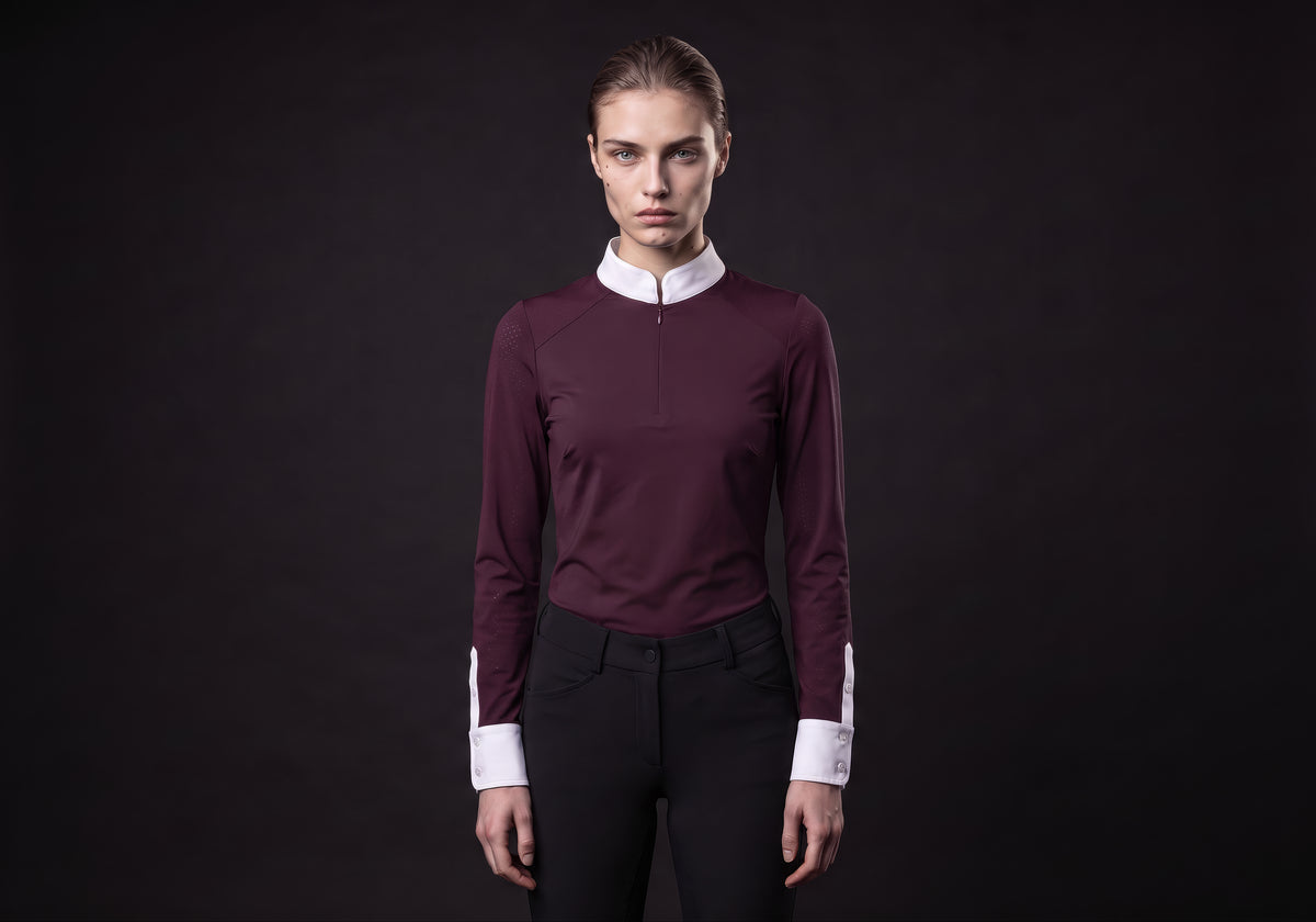 Velmurax women's show shirt in burgundy, worn by the model in a front view on the dark studio set