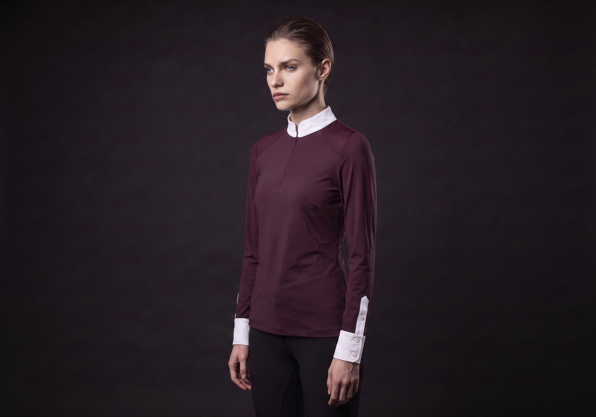 Velmurax women's show shirt in burgundy, in a three-quarter view on the model on the studio set