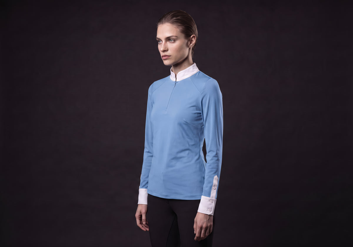 Velmurax women's show shirt in light blue, in a three-quarter view on the model on the studio set