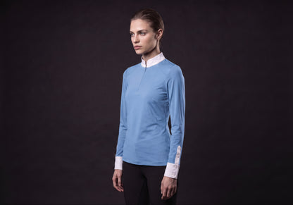 Velmurax women's show shirt in light blue, in a three-quarter view on the model on the studio set