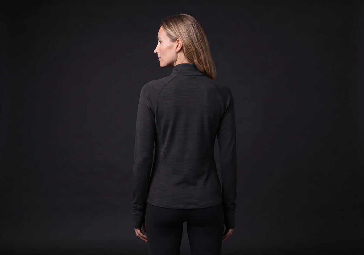 Velmurax women's stretch track jacket in black, seen from the back on the model, showing the back of the garment