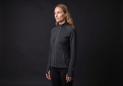 Velmurax women's stretch track jacket in black, in a three-quarter view on the model on the studio set