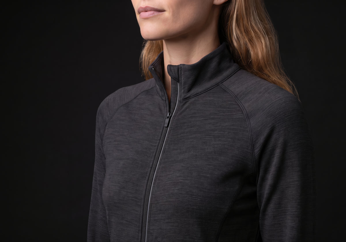 Velmurax women's stretch track jacket in black, in a close detail shot on the model