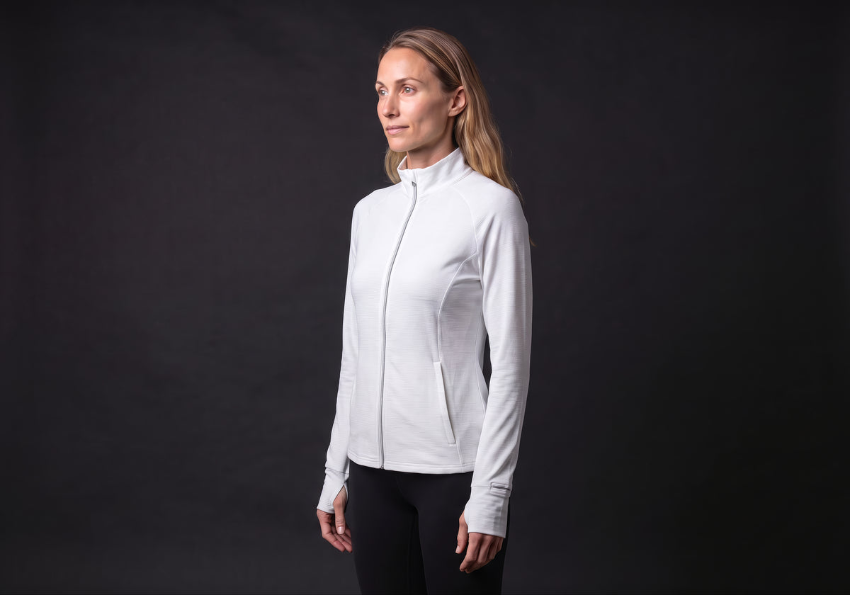 Velmurax women's stretch track jacket in white, in a three-quarter view on the model on the studio set