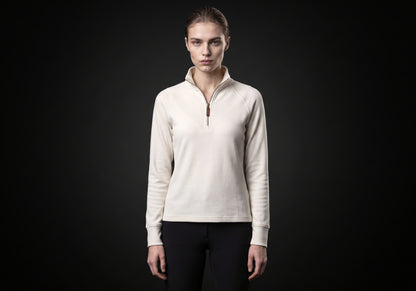 Velmurax women's thermal riding shirt in ivory, worn by the model in a front view on the dark studio set