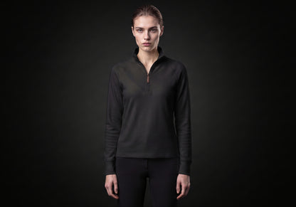 Velmurax women's thermal riding shirt in black, worn by the model in a front view on the dark studio set