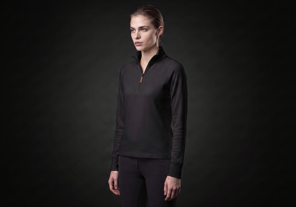 Velmurax women's thermal riding shirt in black, in a three-quarter view on the model on the studio set