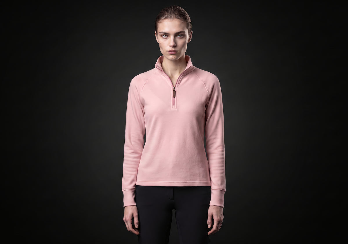 Velmurax women's thermal riding shirt in pink, worn by the model in a front view on the dark studio set