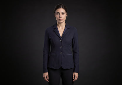 Velmurax women's show jacket in navy, worn by the model in a front view on the dark studio set