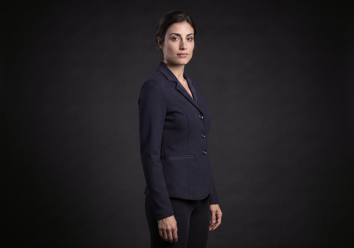 Velmurax women's show jacket in navy, in a three-quarter view on the model on the studio set