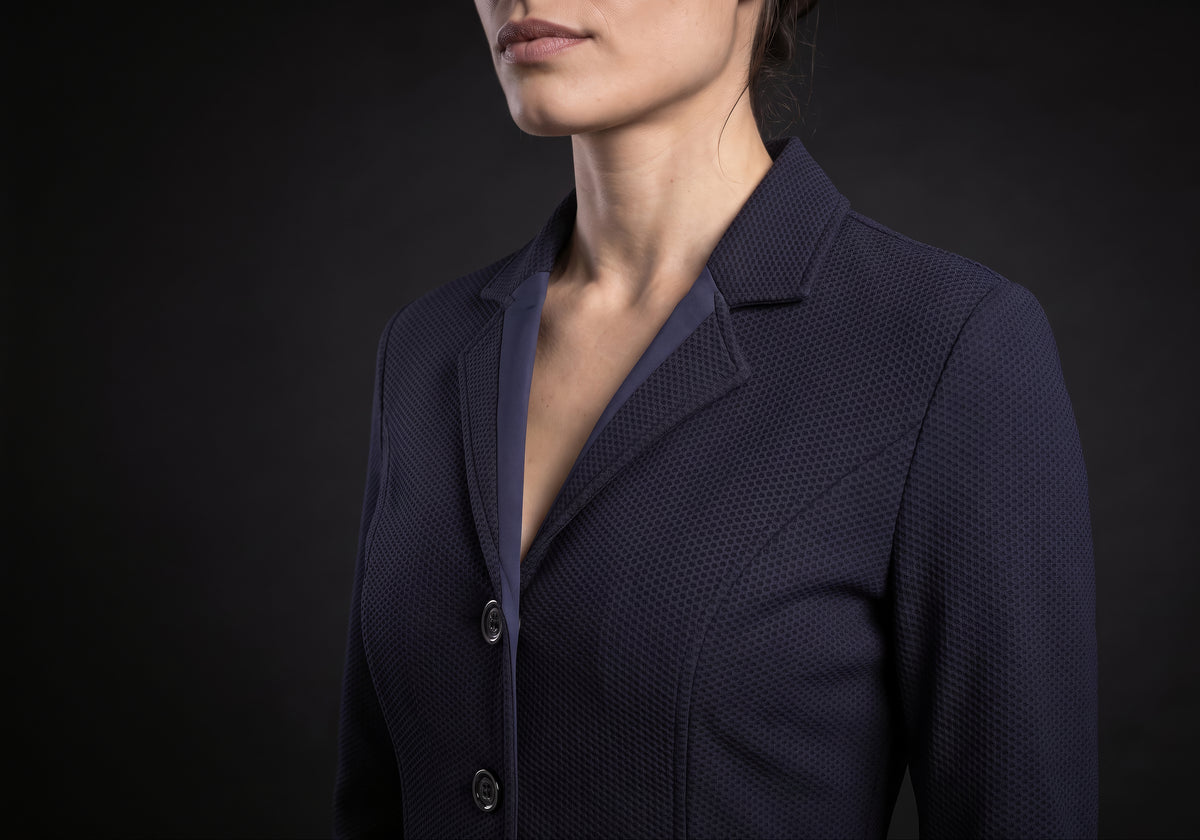 Velmurax women's show jacket in navy, in a close detail shot on the model