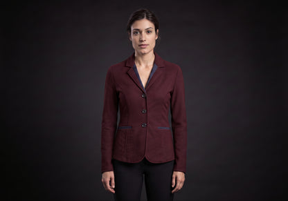 Velmurax women's show jacket in burgundy, worn by the model in a front view on the dark studio set