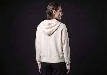 Velmurax wool cashmere zip hoodie in ivory, seen from the back on the model, showing the back of the garment