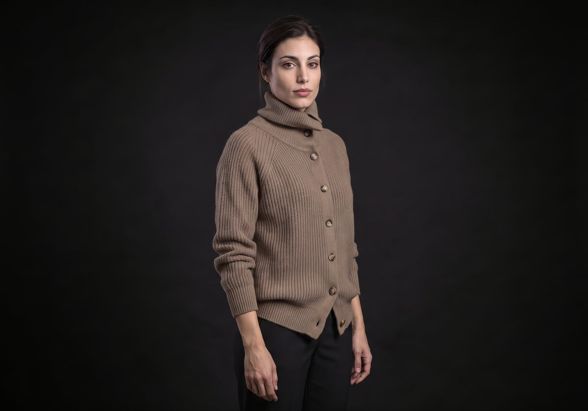 Velmurax wool turtleneck cardigan in taupe in a three-quarter view, showing the raglan sleeve and the split hem