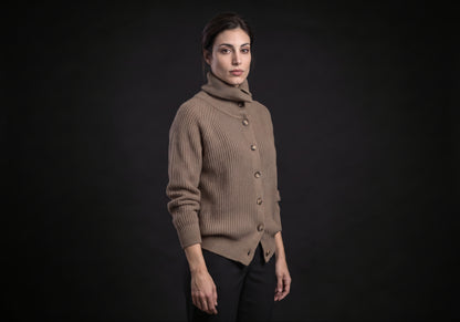 Velmurax wool turtleneck cardigan in taupe in a three-quarter view, showing the raglan sleeve and the split hem